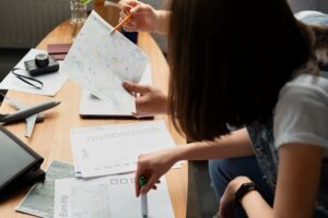 close-up-people-planning-trip-with-map-min daycare marketing agency